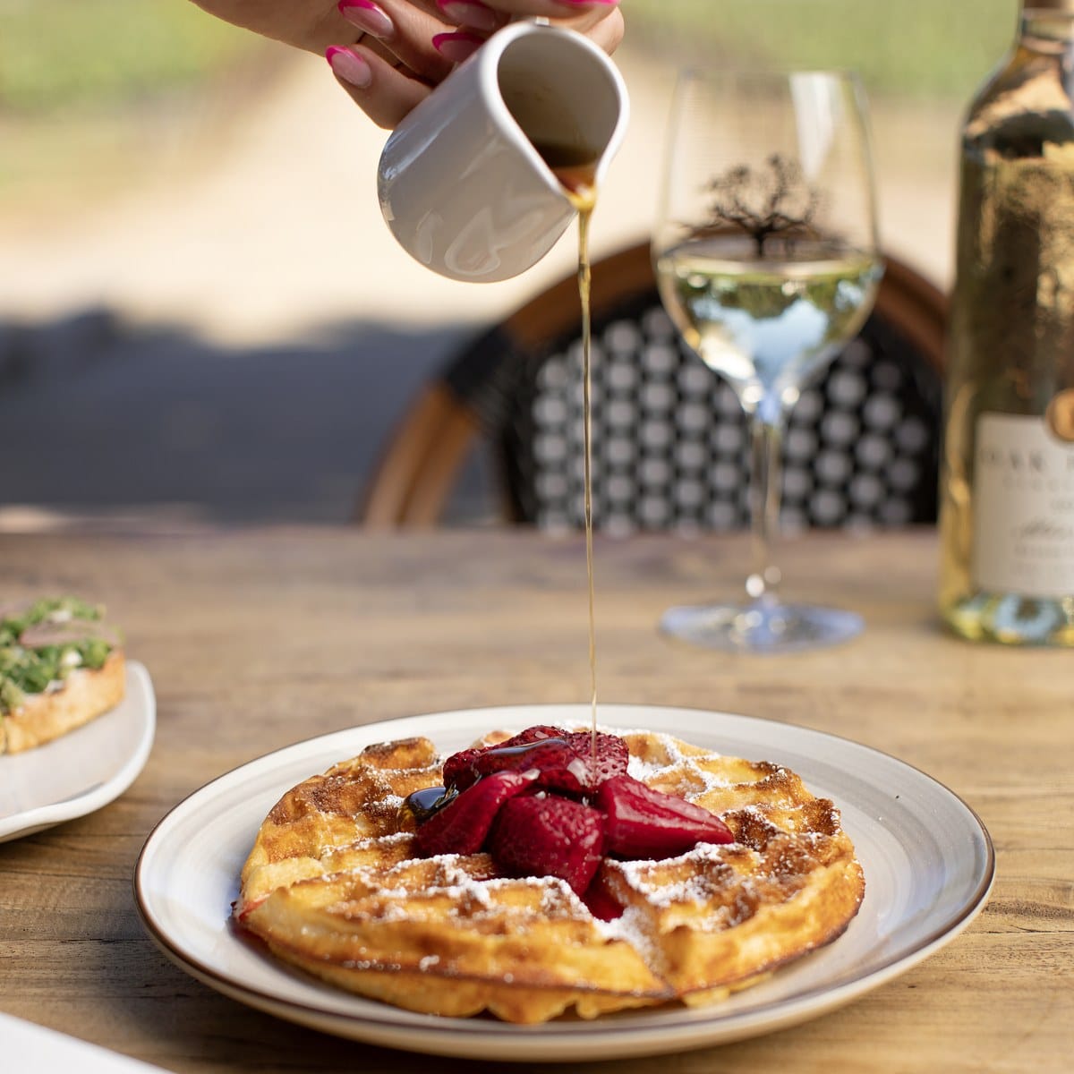 Buttermilk Belgian Waffle (GF) with strawberries and Vermont maple syrup at Oak Farm Vineyards in Lodi